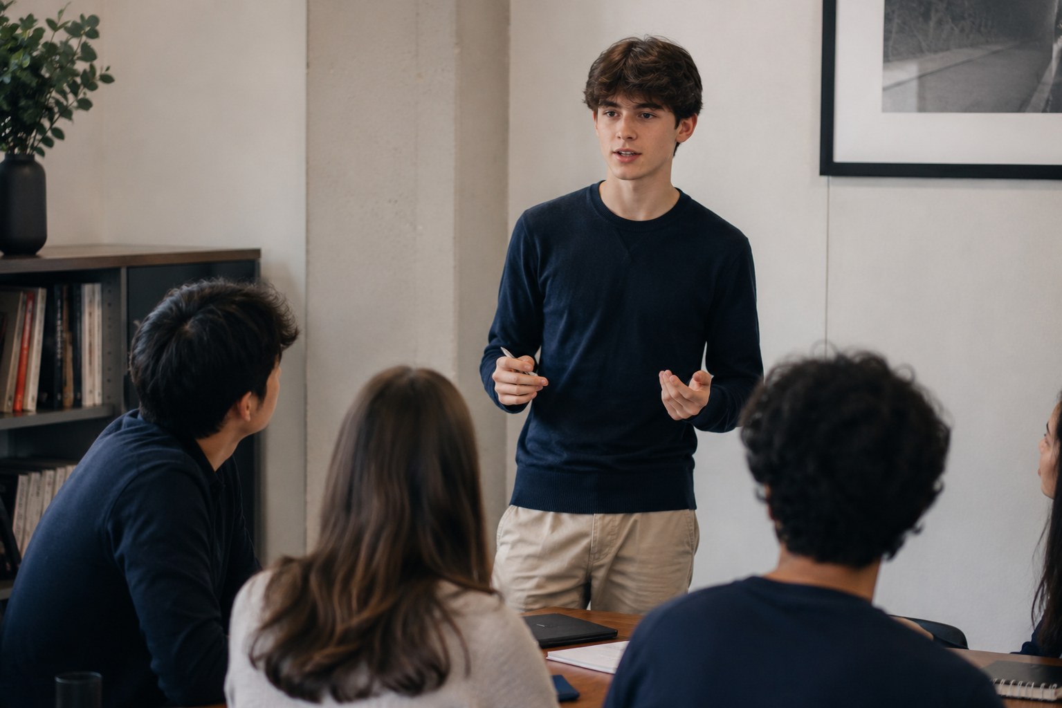 Student presenting to a small group during a public speaking session